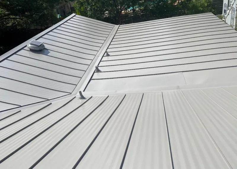 Solar attic fan installed on a metal roof for Roof Ventilation in Green Cove Springs
